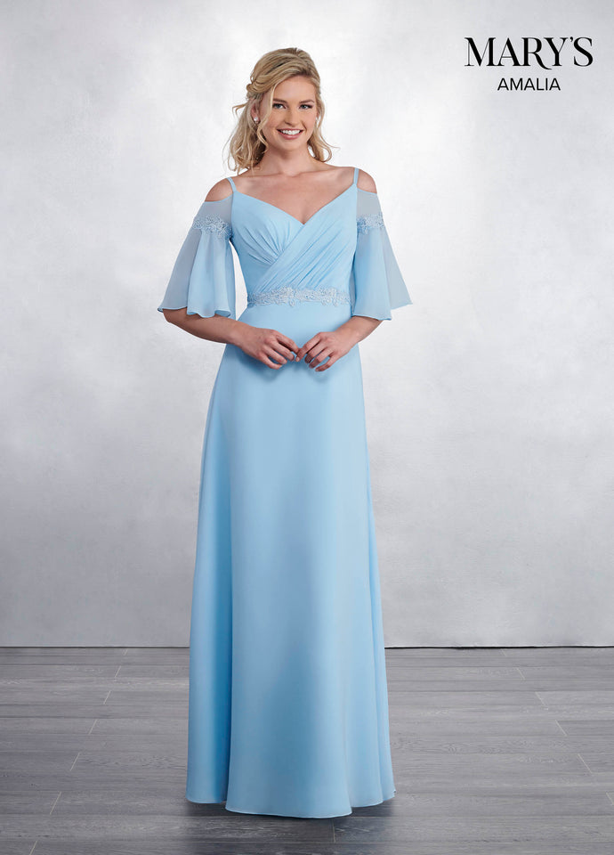 A young woman wearing a long light blue bridesmaid dress.