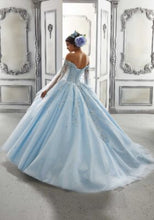 Load image into Gallery viewer, The back view of a young lady wearing a ballgown with cape in the color light blue.
