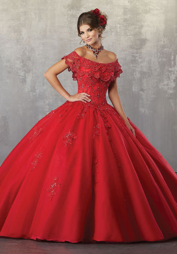 A young lady wearing a scarlet ballgown with flounced neckline.