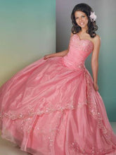 Load image into Gallery viewer, A young lady wearing a strapless princess ballgown.
